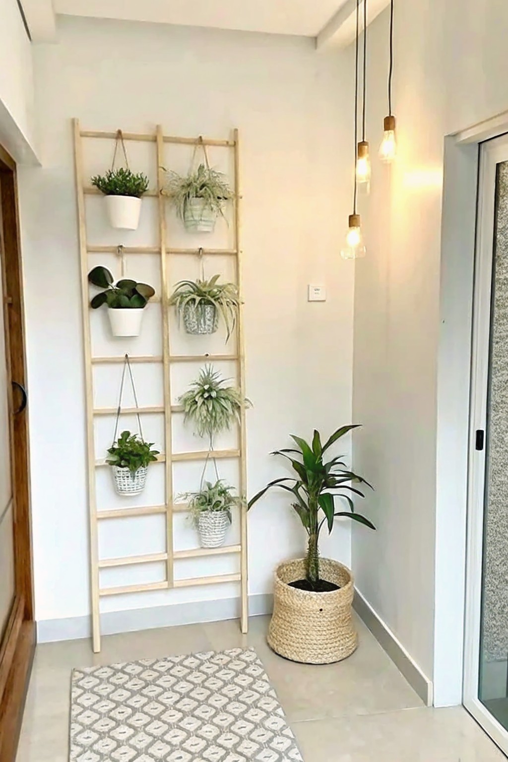 Wooden ladder with hanging potted plants beside woven basket and pendant lights