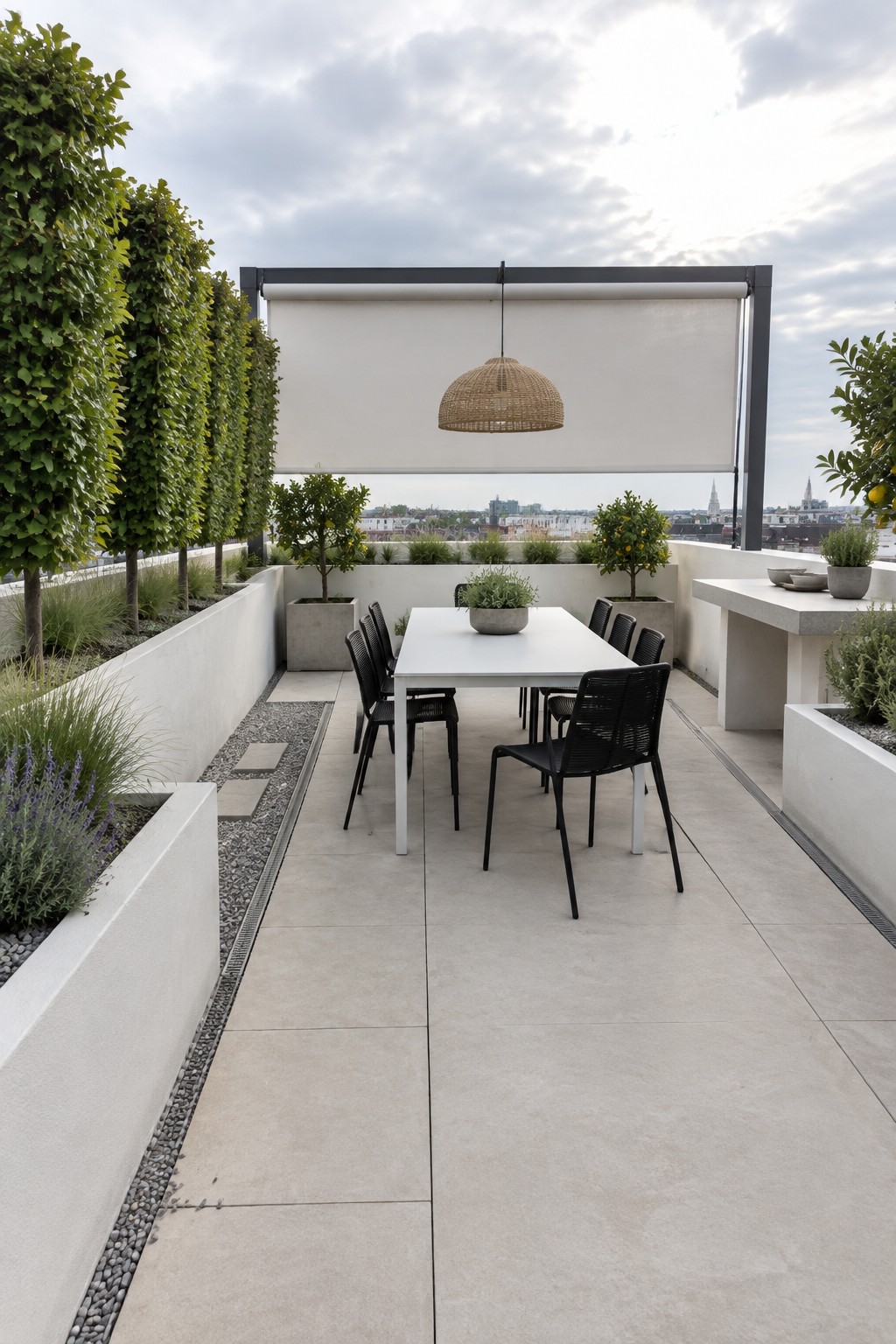 Modern rooftop terrace with white dining table, black chairs, and woven pendant light