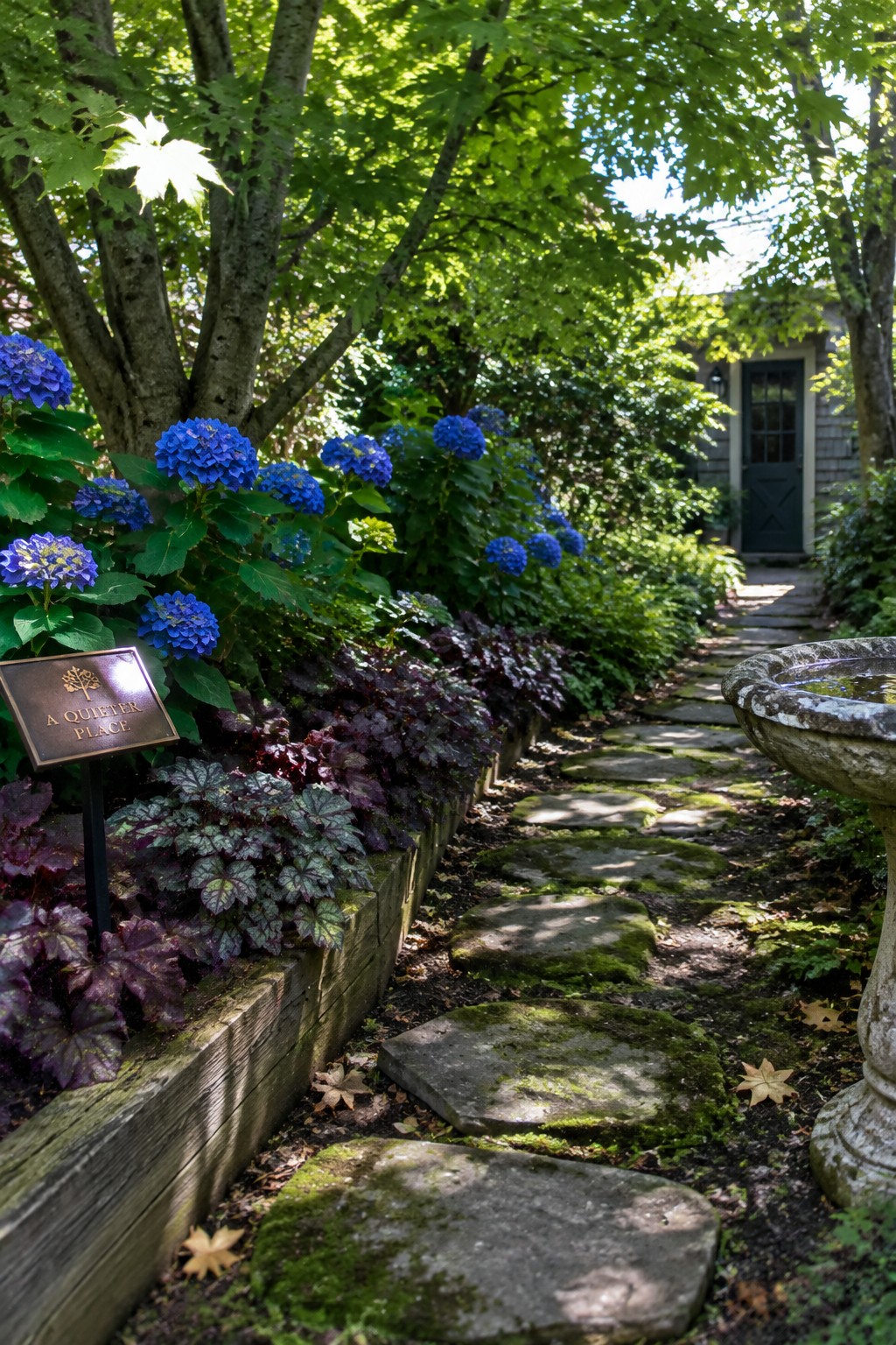 Irregular moss-covered stone steps wind past blue hydrangeas and leafy plants toward a garden door.